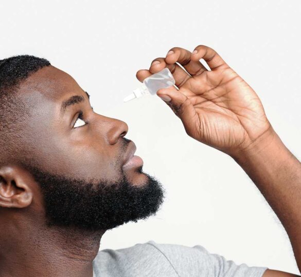 black-man-using-eye-drops_900-585x540