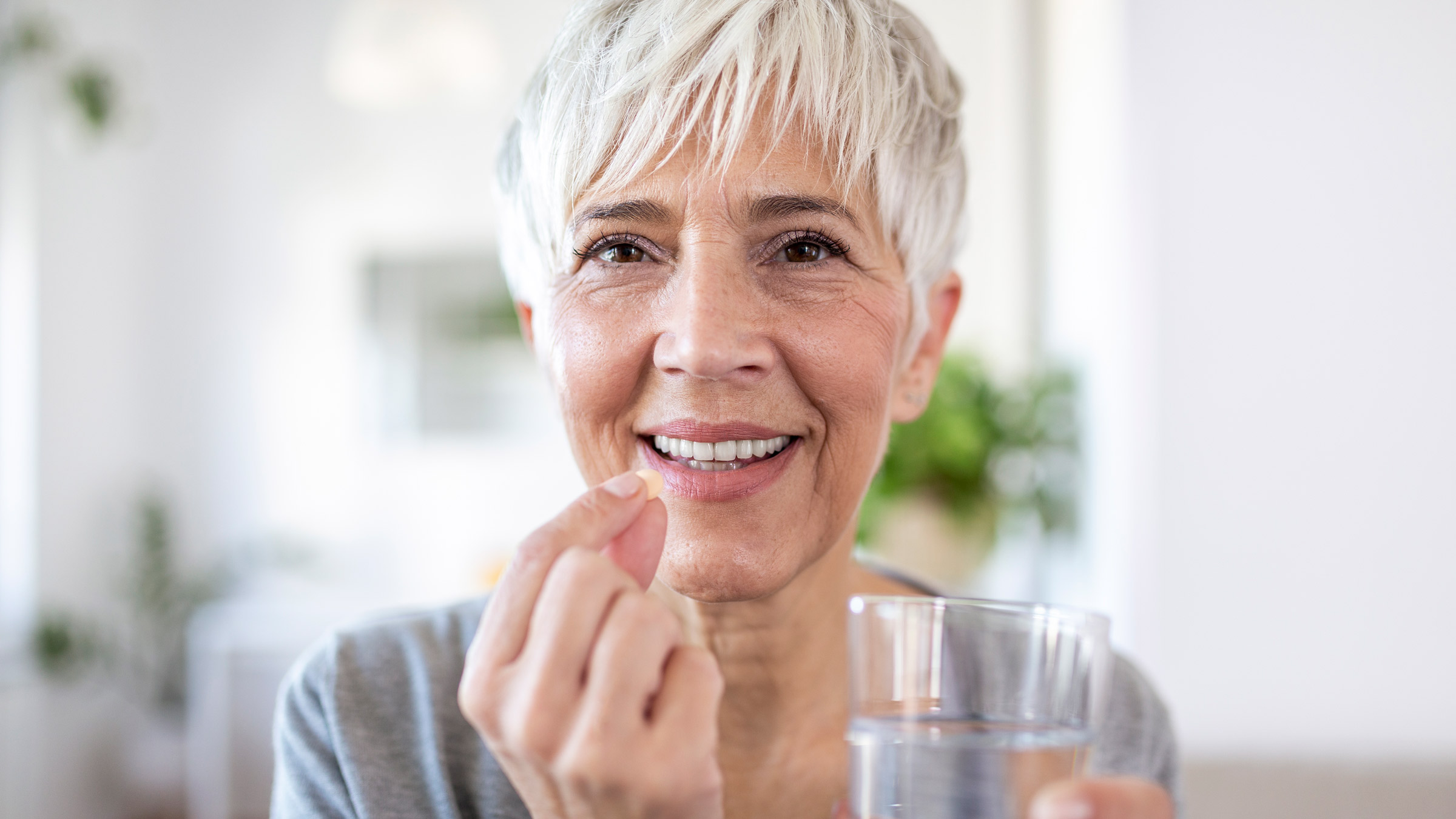 holding_water_and_pill_1352436644