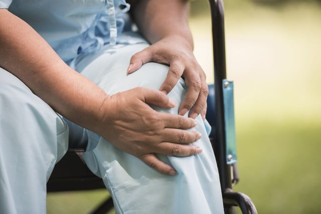 mini-elderly-woman-sitting-wheelchairs-with-knee-pain